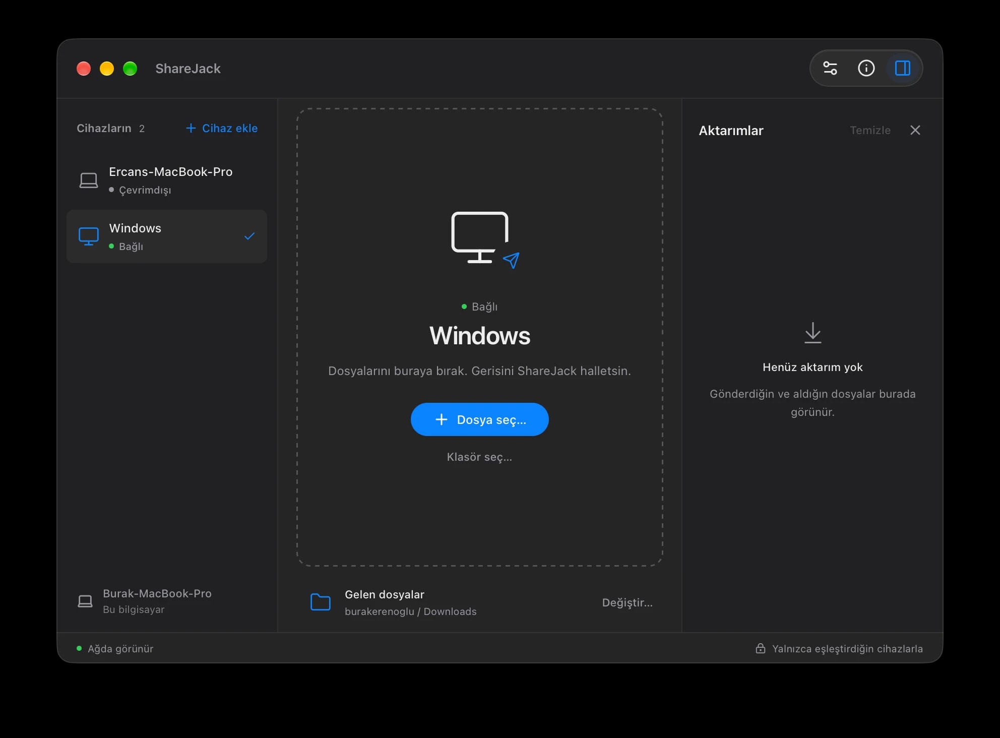 ShareJack on macOS with a paired Windows computer, file and folder drop area, and transfer history.